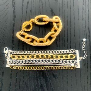 Gold tone bracelets.